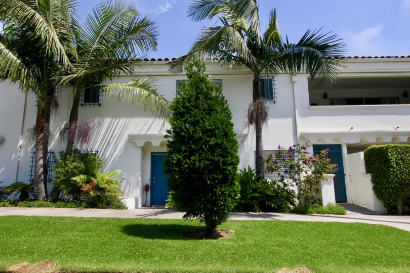 A great day in the The Mediterranean with a lawn and tree.