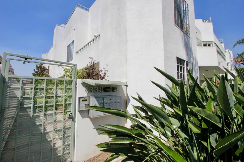 The entryway to a sunny building at The Stanford in Santa Monica, California.