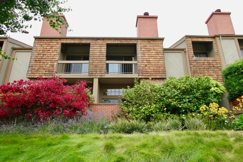 Green, red flowers, Green Lawns and brown walls of Villas Vicente, Santa Monica, California