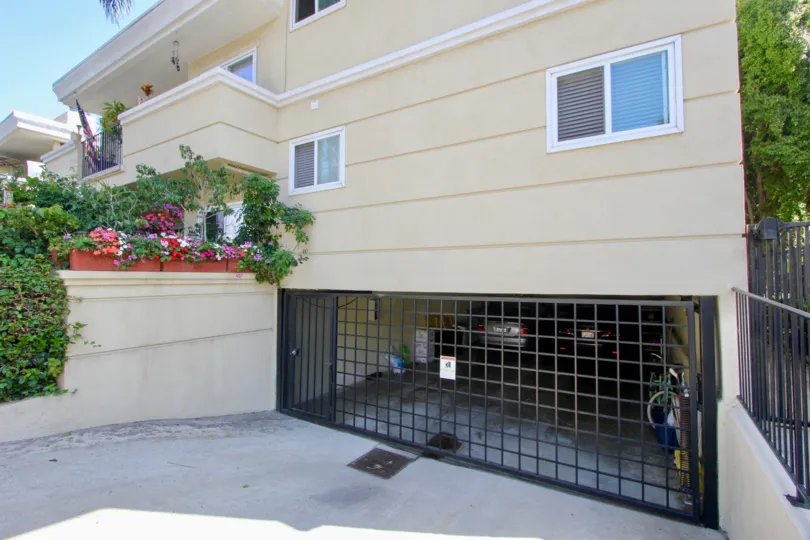 Large home in santa monica with parking spots and pots of flowers