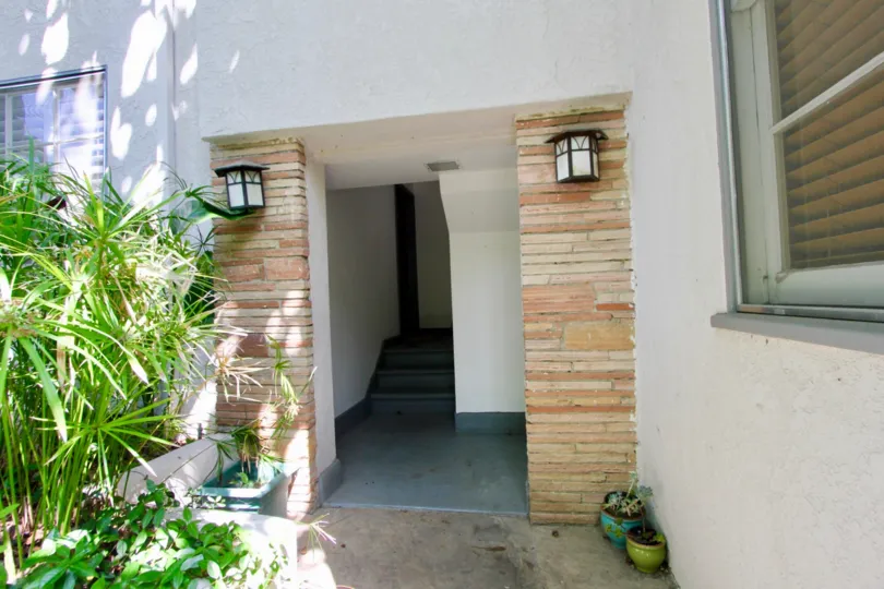 Simple entry of a home in santa monica with lights and light colors