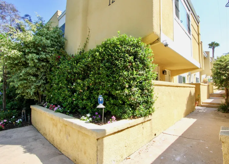 A bright day in the Yale Villas with a yellow color building.