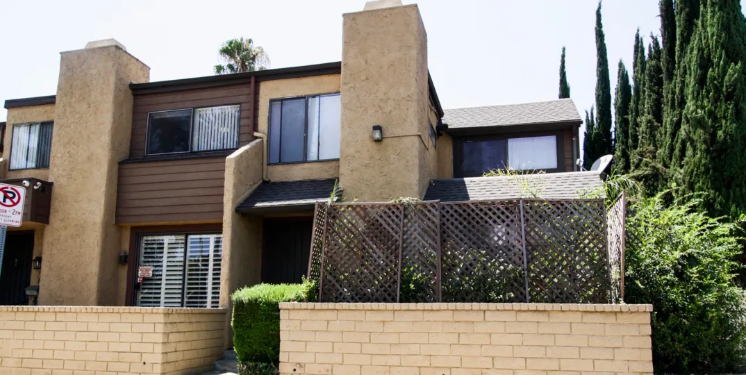 The privacy fence in front of units at 14313 Hartsook St in Sherman Oaks