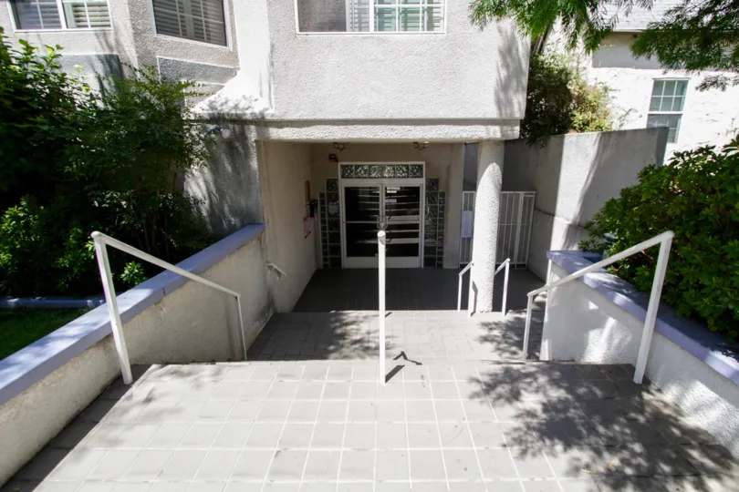 The stairs leading down into 14415 Benefit St