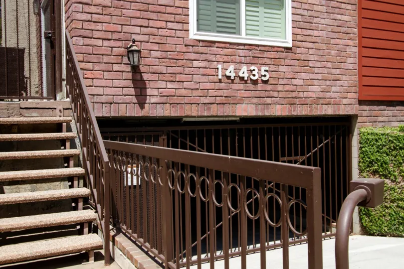 The written address on the side of the building at 14435 Benefit St