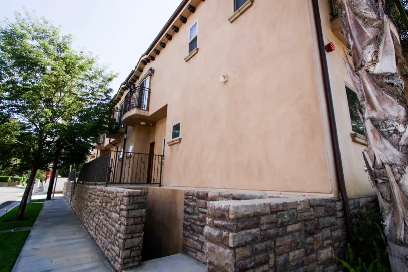 The rock wall on the property at 14702 Magnolia Blvd