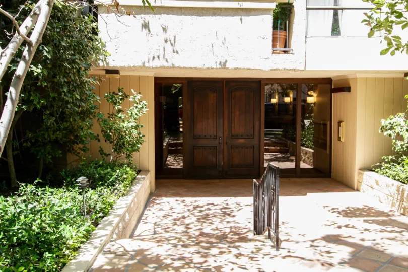 The double door entrance into Benefit Condominiums