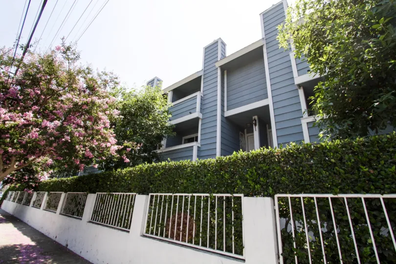 The fence around the property of Burbank Townhomes