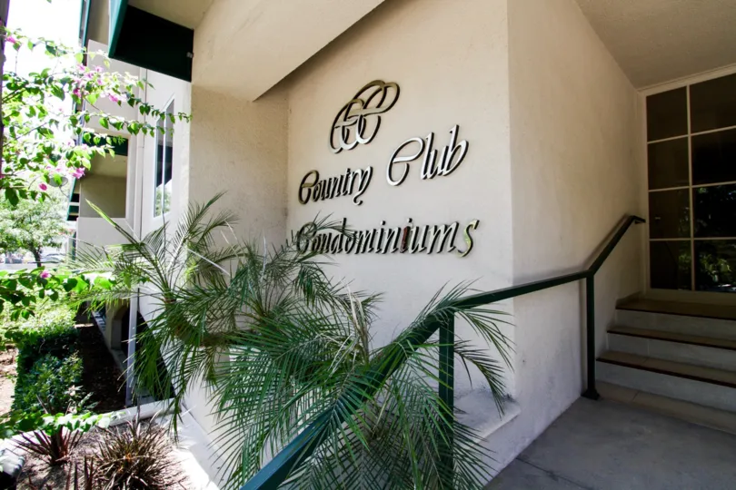 The Country Club Condominiums name written on the building