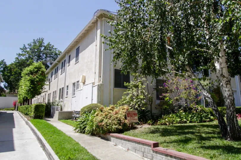 The sidewalk beside the building at Dickens Street Gardens