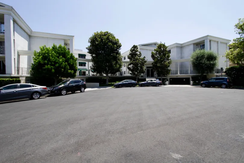The curb alongside Golden Colonial Condominiums