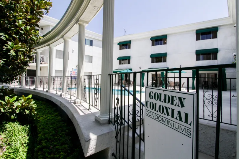 The sign into Golden Colonial Condominiums