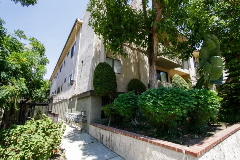 The sidewalk on the side of Riverside Villa