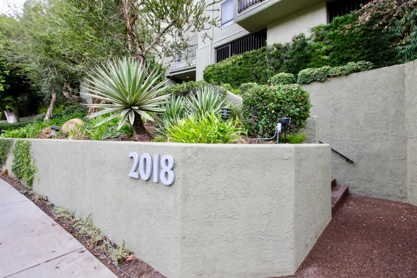 The Cedar Lodge address in front of the building