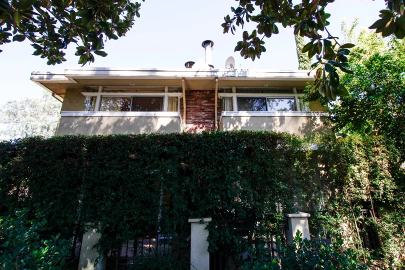 The hedges seen around the building at 4312 Gentry Ave