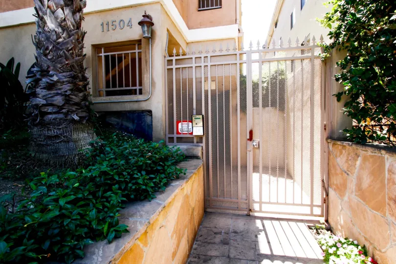 The gated side entrance into Camellia Park located in Studio City