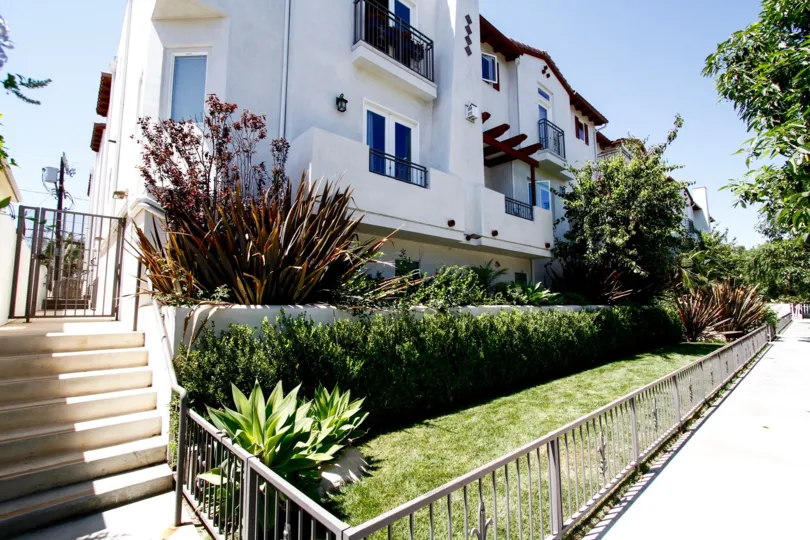 The hedges around the Colfax Villas building