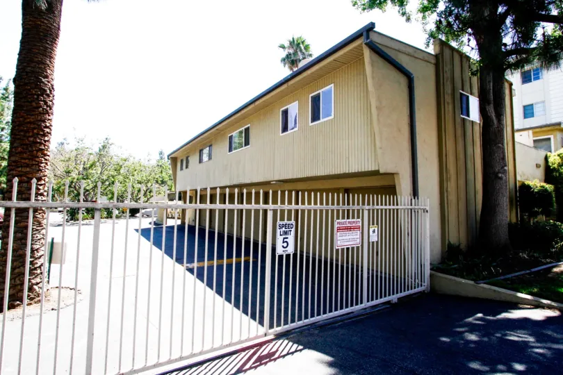 The privacy gate for entrance into the parking at Studio City Villas