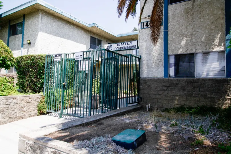 The gate into Emily Condominiums
