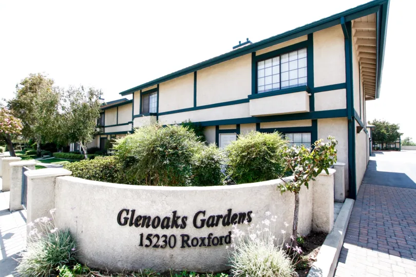 The name and address of Glenoaks Gardens at the entrance into the property