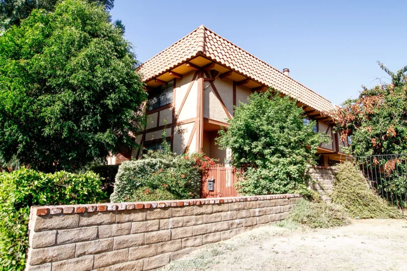 The stone fence around 5830 Etiwanda Ave in CA California