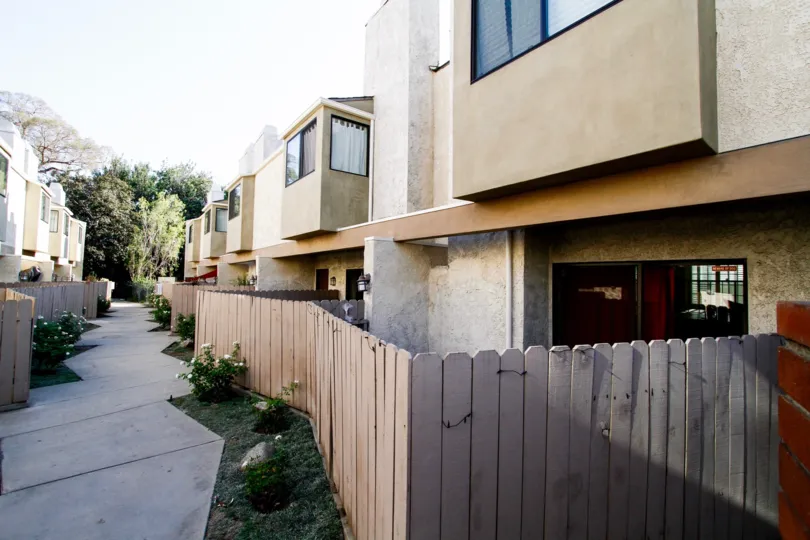 The fence surrounding Burbank Townhomes units