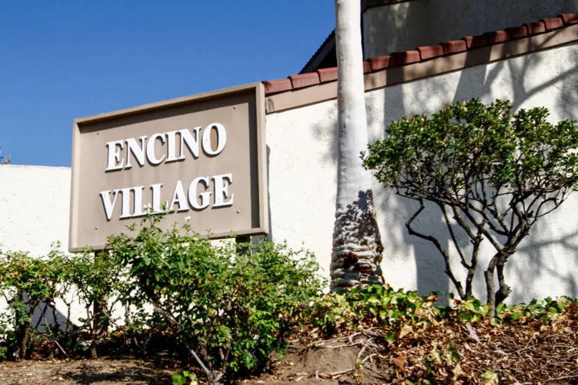 The name of Encino Village at the entrance