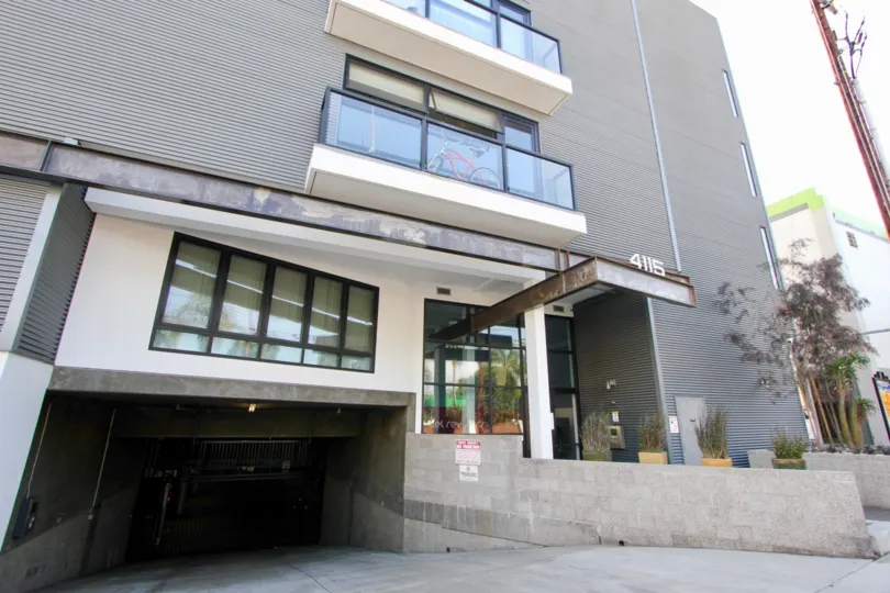 Earth tone motif three story Del Rey Lofts Building with balconies and underground garage in Venice California