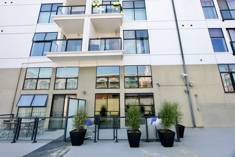 An entrance of a hotel at sunny day in Del Rey Lofts
