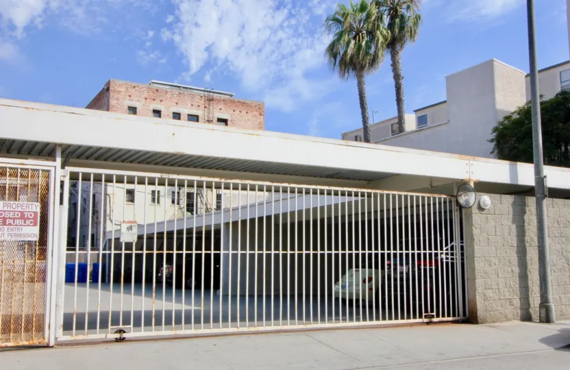 sunny weather with large gate of metal of a big building in California