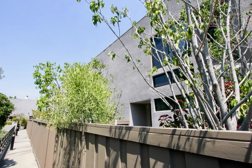 side view of Havenhurst Townhomes ( 1327) with trees and borders..