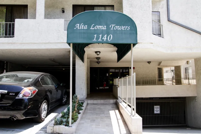 The address of Alta Loma Towers at the entrance