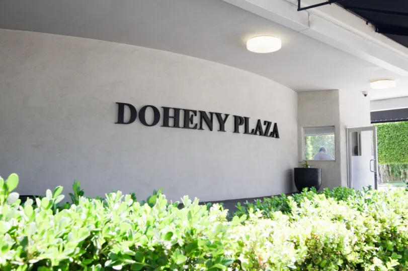 The Doheny Plaza name written on the building