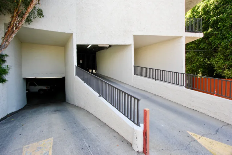 The shady driveway and entrance ramp at Horn Plana in West Hollywood.