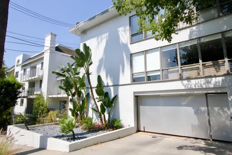 white house in Larrabee Villas in a sunny day with plants