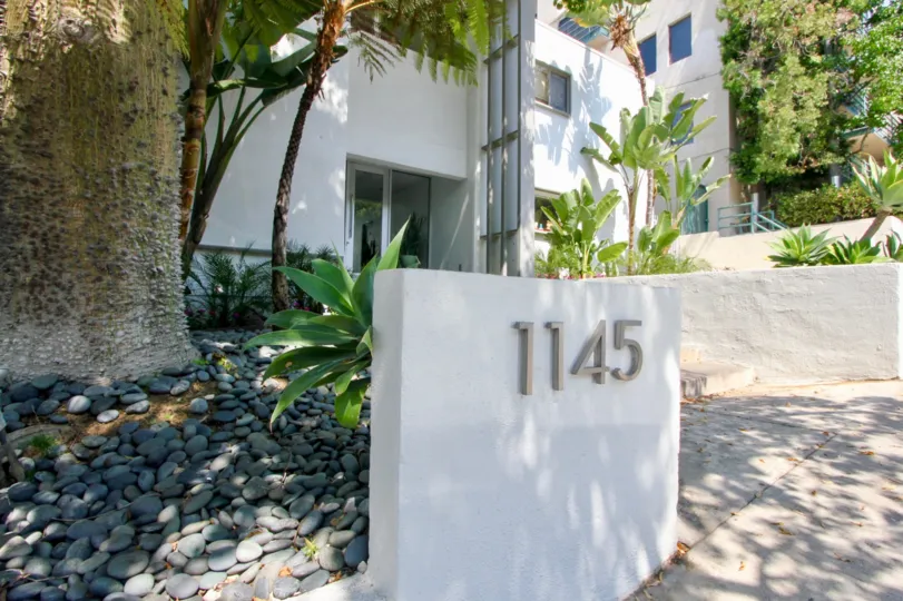 A sunny afternoon along the sidewalk at Larrabee Villas.