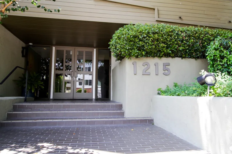 The address written at the entrance of Olive Executive Townhomes