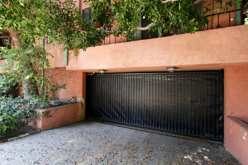 The gate into the parking area of Sherwood Townhomes