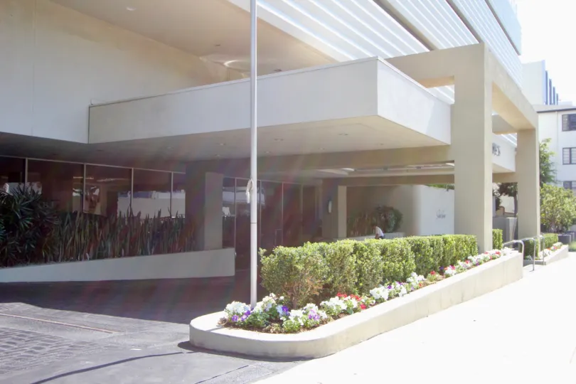 the front part of a building in sierra towers in a sunny day