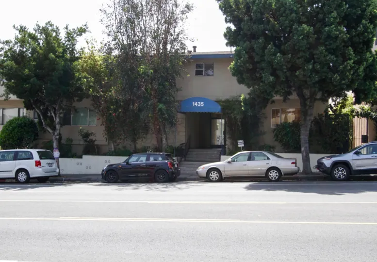 The curb in front of Sunset Palms