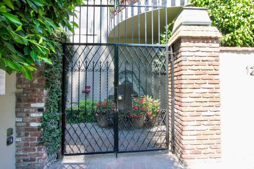 the front door of a house in Sunset Plaza Terrace with plants