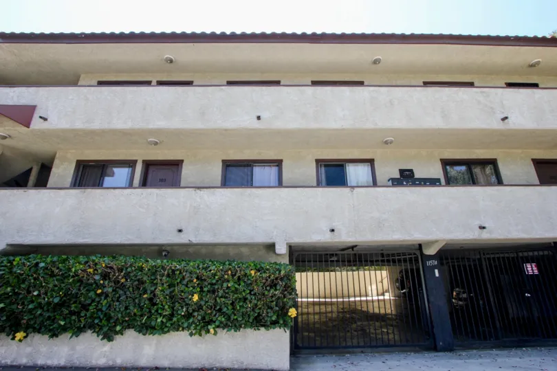 a brown building in 11574 Ohio with plants at the front