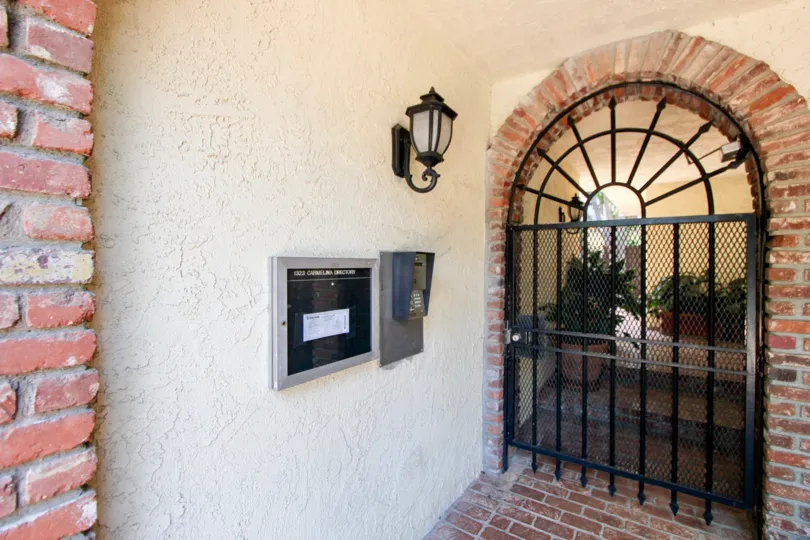 the front door of a house in the 1323 Carmelina in a sunny day