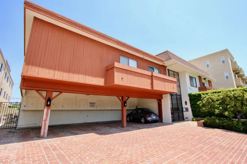 big red building with car parking in 1522 Centinela, west la