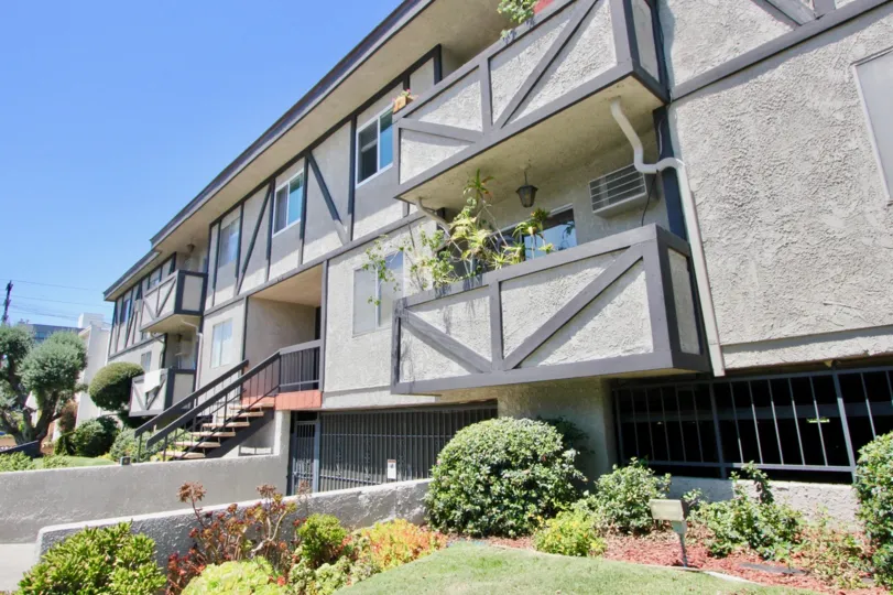 Sunny day at 1914 Corinth in West LA, California. A nice garden, stairway entrance, balconies and windows.