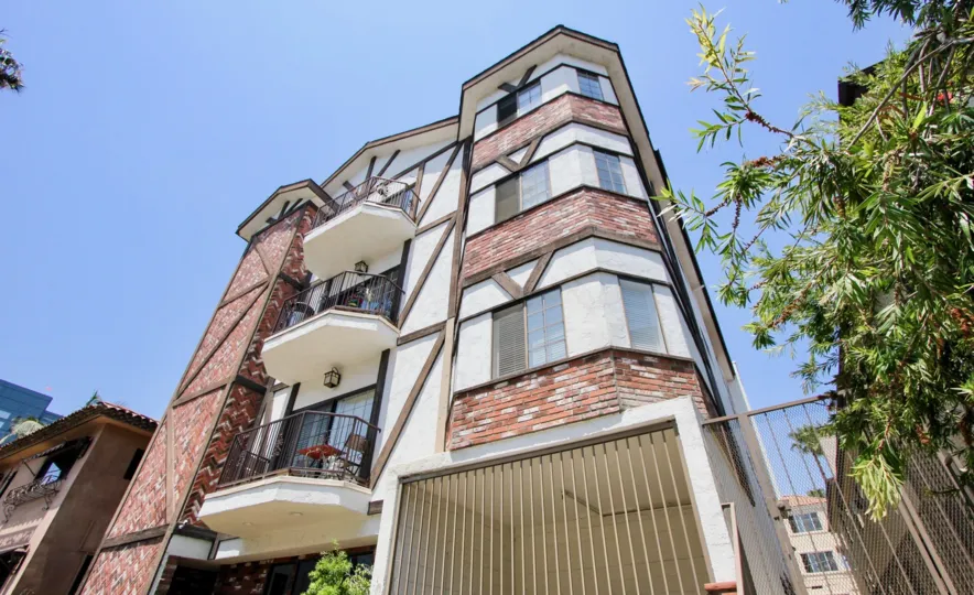 upward shot of the brick styled Amherst Chateau, West la, california