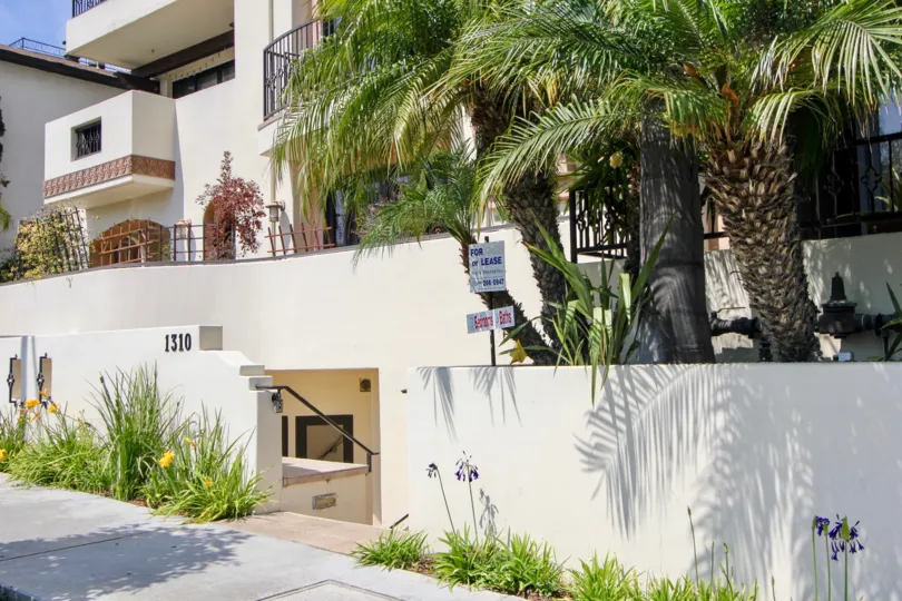 Balconies and terraces, among mature landscaping, line the Armacost Villas in West LA, California