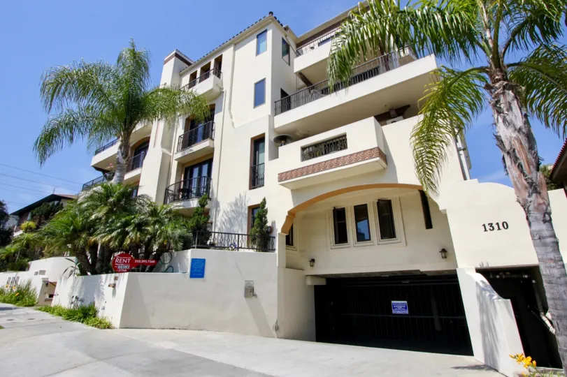 An apartment building complex for rent in the West LA, California community of Armacost Villas surrounded by palm trees