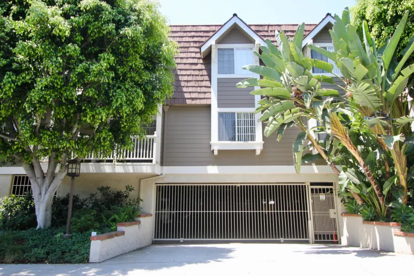 Simple and elegant house with tiled roof amid a rich greenery in Barry Avenue Vistas neighborhood