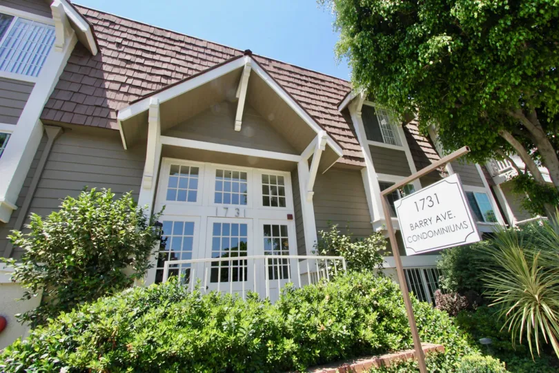 Triangle pointy roof and grassy shrub gardens curb appeal A plus